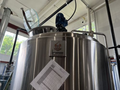 Green Door distilling tank close up with Crawford Brewing Equipment logo